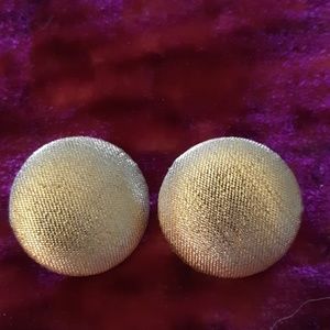 Two pair of pierced gold colored button earrings